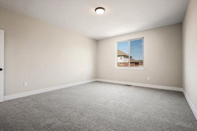 24599 Brookshire Dr, Macomb, MI 48042 - carpeted spare room featuring baseboards and visible vents