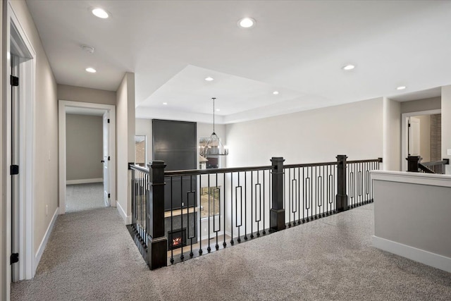 24599 Brookshire Dr, Macomb, MI 48042 - hallway featuring recessed lighting, carpet, baseboards, and a raised ceiling
