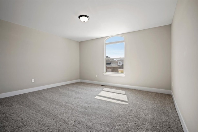 24599 Brookshire Dr, Macomb, MI 48042 - empty room with carpet floors, baseboards, and visible vents