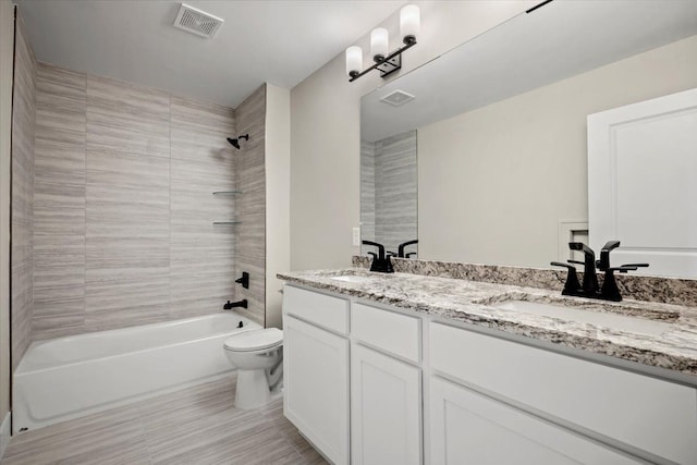 24599 Brookshire Dr, Macomb, MI 48042 - full bath featuring toilet, visible vents, bathing tub / shower combination, and a sink