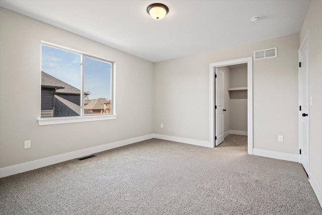 24599 Brookshire Dr, Macomb, MI 48042 - unfurnished bedroom with visible vents, baseboards, and carpet floors