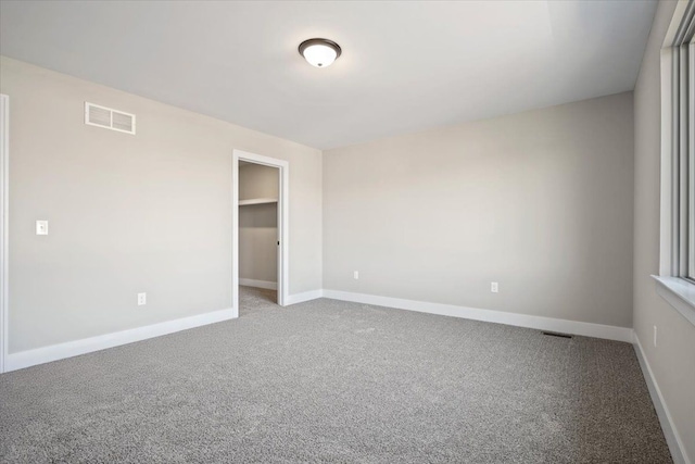 24599 Brookshire Dr, Macomb, MI 48042 - unfurnished bedroom with carpet floors, baseboards, and visible vents