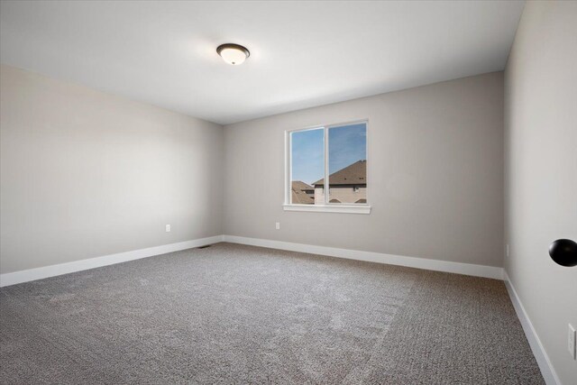 24599 Brookshire Dr, Macomb, MI 48042 - empty room featuring baseboards and carpet
