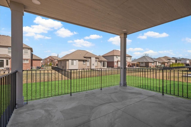 24599 Brookshire Dr, Macomb, MI 48042 - view of patio / terrace with fence and a residential view