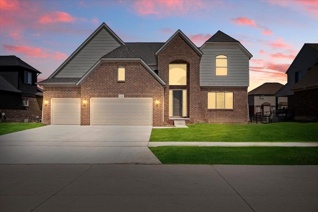 24599 Brookshire Dr, Macomb, MI 48042 - traditional-style house with brick siding, a front lawn, an attached garage, and concrete driveway