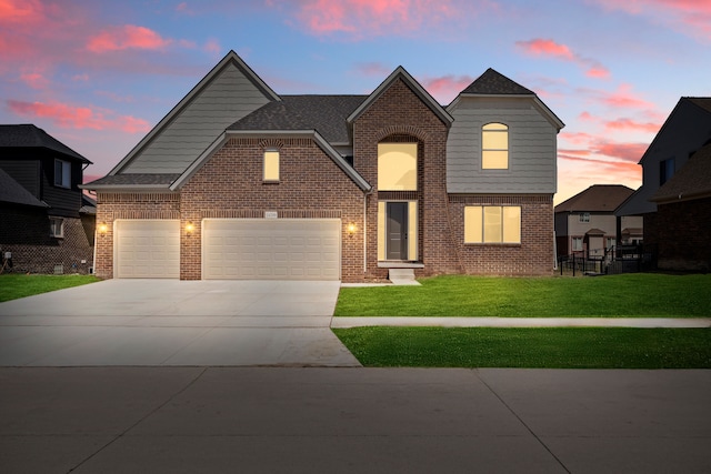 24599 Brookshire Dr, Macomb, MI 48042 - traditional-style house featuring concrete driveway, brick siding, an attached garage, and a front yard