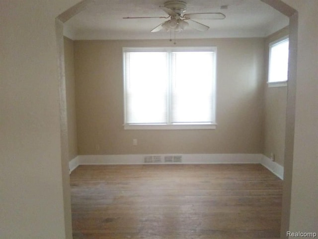 14595 Terry St, Detroit, MI 48227 - spare room featuring baseboards, visible vents, wood finished floors, and a ceiling fan