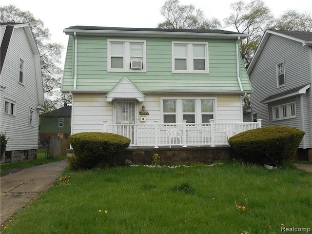 14595 Terry St, Detroit, MI 48227 - colonial home with covered porch and a front lawn