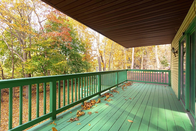 4725 Hickory Dr, Highland, MI 48356 - wooden terrace with view of wooded area