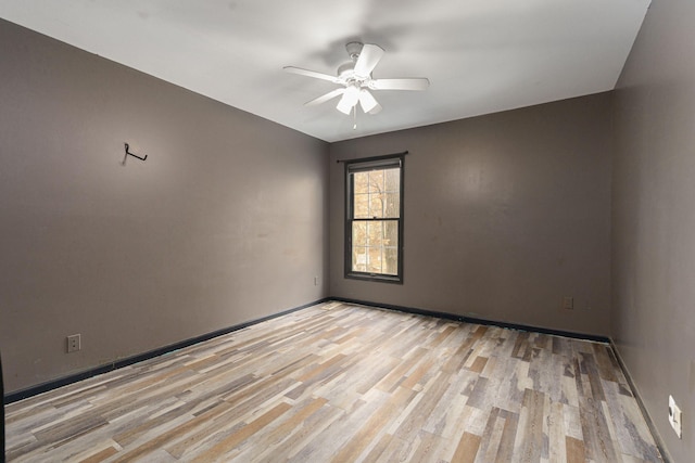 4725 Hickory Dr, Highland, MI 48356 - spare room with ceiling fan and light wood-style floors