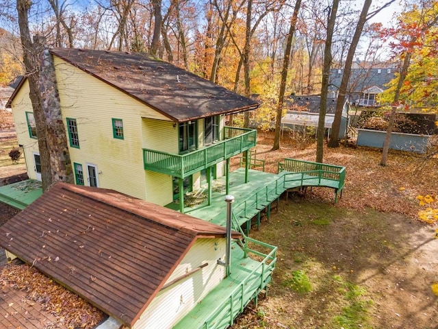 4725 Hickory Dr, Highland, MI 48356 - view of yard featuring a deck, a balcony, and stairway