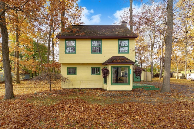 4725 Hickory Dr, Highland, MI 48356 - view of front of house featuring a chimney