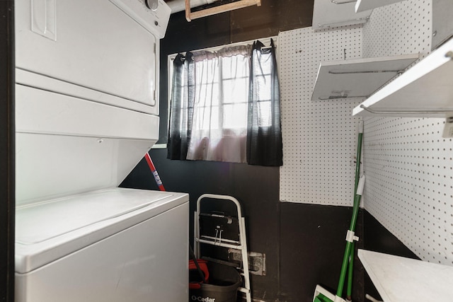 4725 Hickory Dr, Highland, MI 48356 - laundry area with stacked washer / drying machine