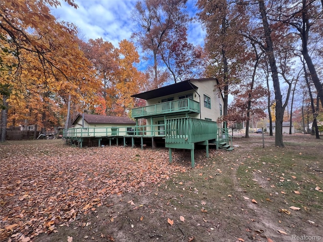 4725 Hickory Dr, Highland, MI 48356 - back of house featuring a wooden deck
