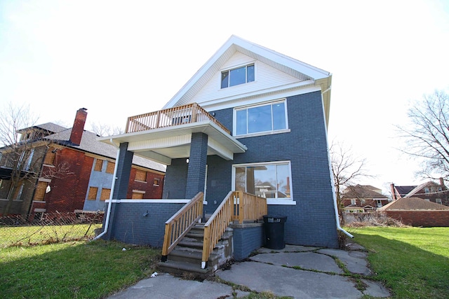1685 Glynn, Detroit, MI 48206 - view of front of property with a balcony, brick siding, fence, and a front yard