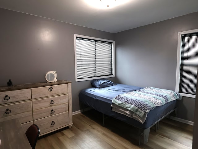 81 E Fairmount Ave, Pontiac, MI 48340 - bedroom with light wood-style flooring and baseboards
