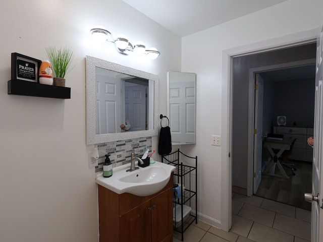 81 E Fairmount Ave, Pontiac, MI 48340 - bathroom with tile patterned flooring, vanity, baseboards, and decorative backsplash