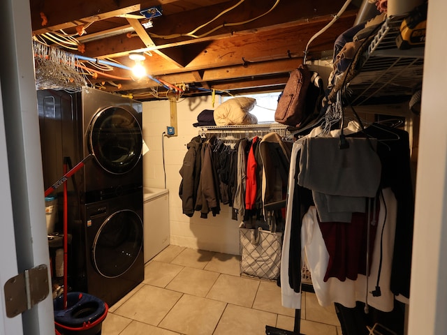 81 E Fairmount Ave, Pontiac, MI 48340 - clothes washing area with stacked washer and dryer and light tile patterned floors