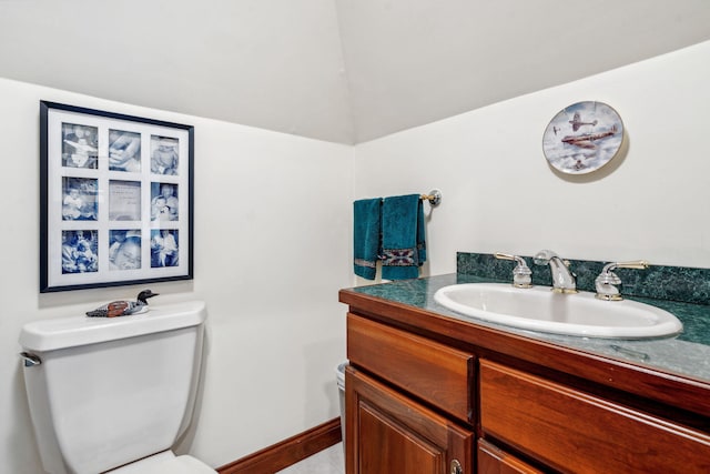 6242 131st St, Saugatuck, MI 49453 - bathroom with baseboards, toilet, and vanity