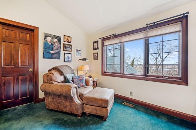 6242 131st St, Saugatuck, MI 49453 - living area featuring baseboards, lofted ceiling, visible vents, and carpet floors