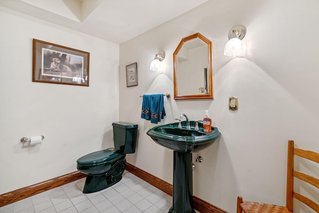 6242 131st St, Saugatuck, MI 49453 - bathroom featuring tile patterned flooring, toilet, and baseboards