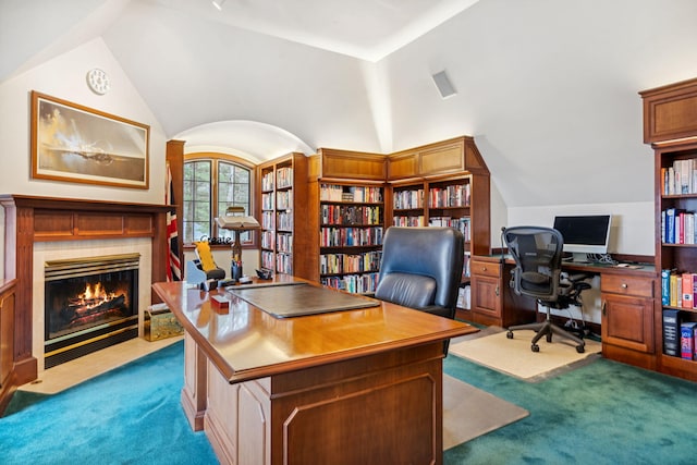 6242 131st St, Saugatuck, MI 49453 - carpeted office space featuring a tiled fireplace and vaulted ceiling