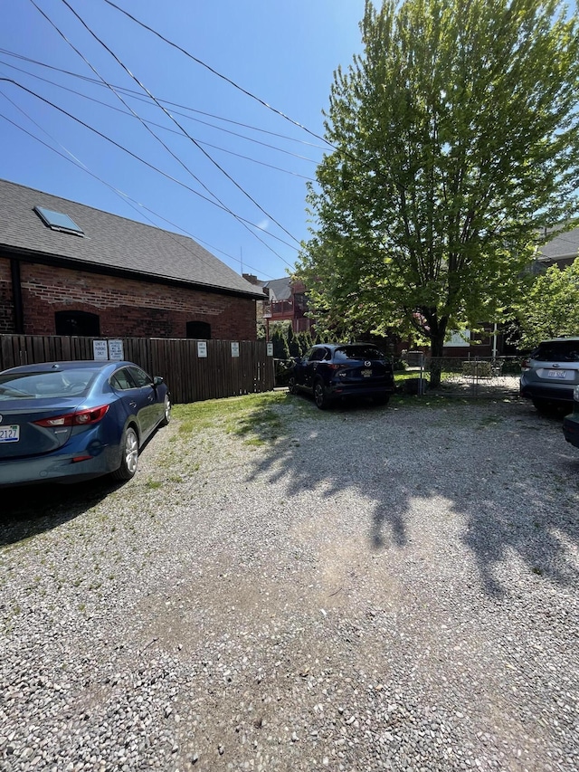 view of home's exterior with fence
