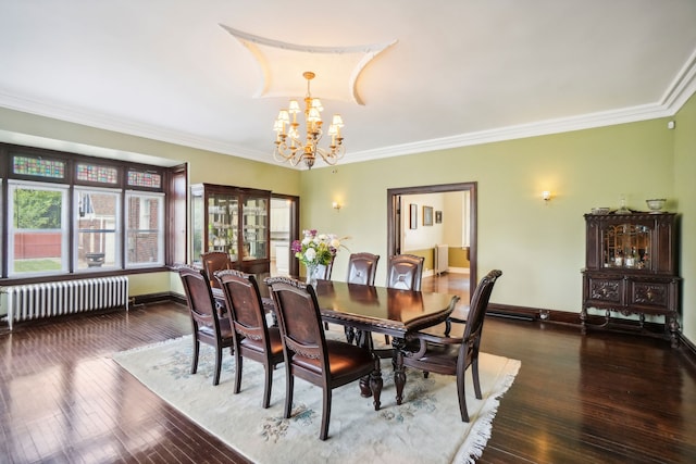 dining space featuring radiator heating unit, a chandelier, ornamental molding, hardwood / wood-style floors, and baseboards