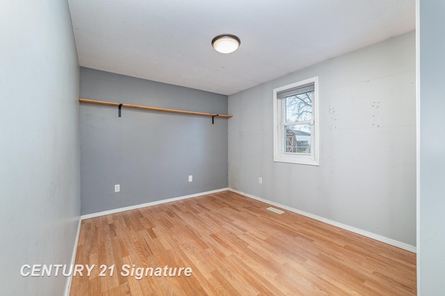 5024 Kencliff Dr, Saginaw, MI 48638 - unfurnished room with baseboards, visible vents, and light wood finished floors