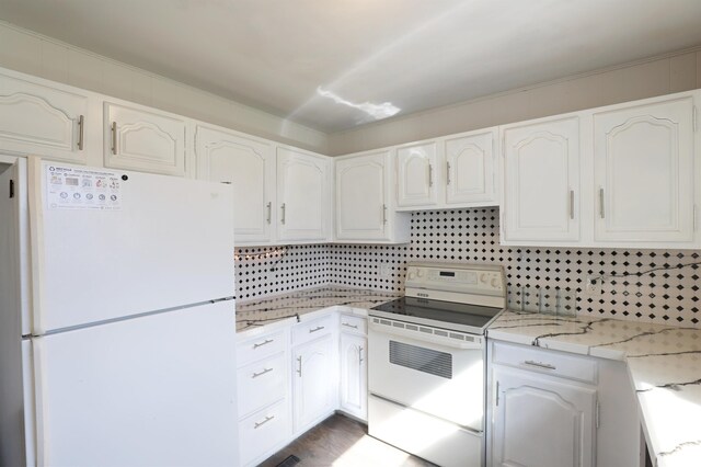 1406 Lincoln Ave, Flint, MI 48507 - kitchen with tasteful backsplash, white cabinets, white appliances, and light stone counters