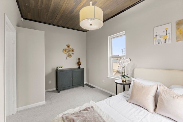 carpeted bedroom with wooden ceiling, baseboards, and visible vents