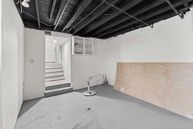 finished basement featuring stairs