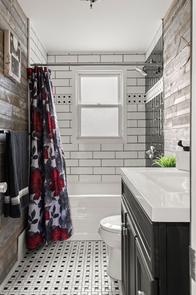 full bathroom with toilet, vanity, tile patterned flooring, and shower / bathtub combination with curtain