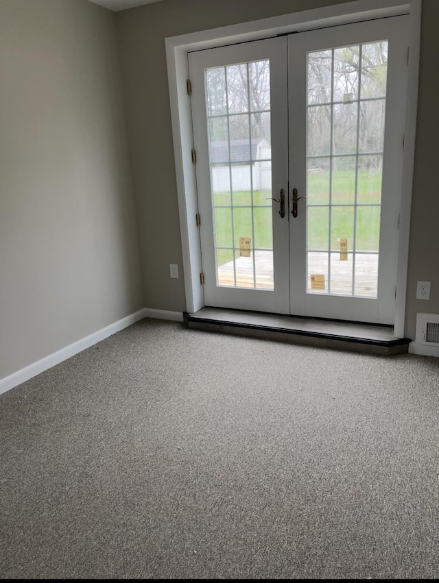 entryway featuring carpet flooring, french doors, baseboards, and visible vents