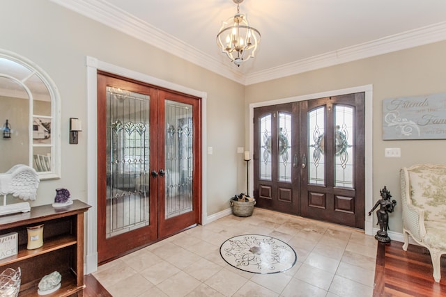 5050 Pleasant Lake Rd, Ann Arbor, MI 48103 - entrance foyer with french doors, a chandelier, light tile patterned flooring, and ornamental molding