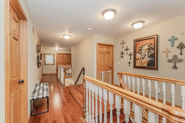 5050 Pleasant Lake Rd, Ann Arbor, MI 48103 - corridor with an upstairs landing and light wood-style flooring