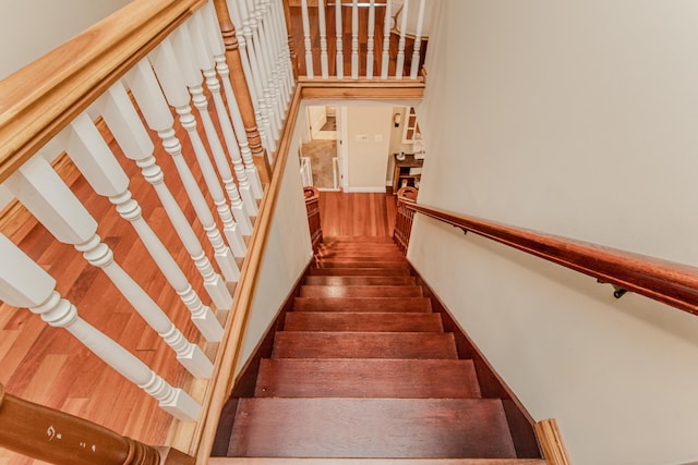 5050 Pleasant Lake Rd, Ann Arbor, MI 48103 - stairway featuring wood finished floors