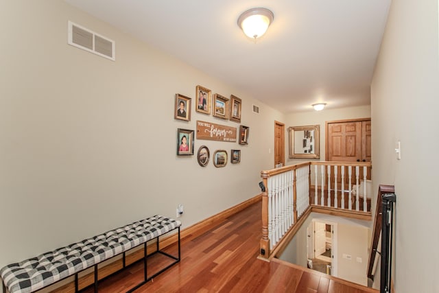 5050 Pleasant Lake Rd, Ann Arbor, MI 48103 - corridor with an upstairs landing and wood finished floors