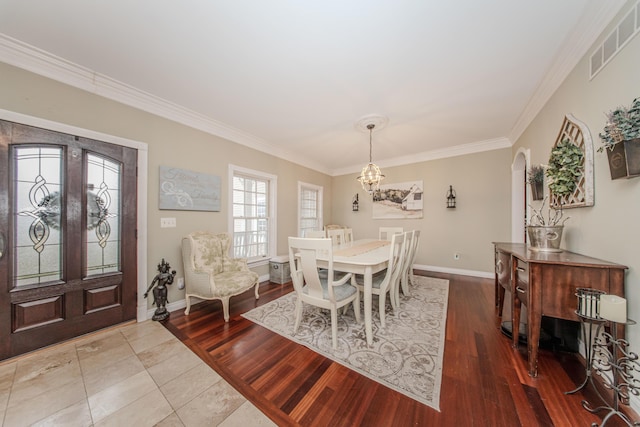 5050 Pleasant Lake Rd, Ann Arbor, MI 48103 - dining area with a chandelier, crown molding, and wood finished floors