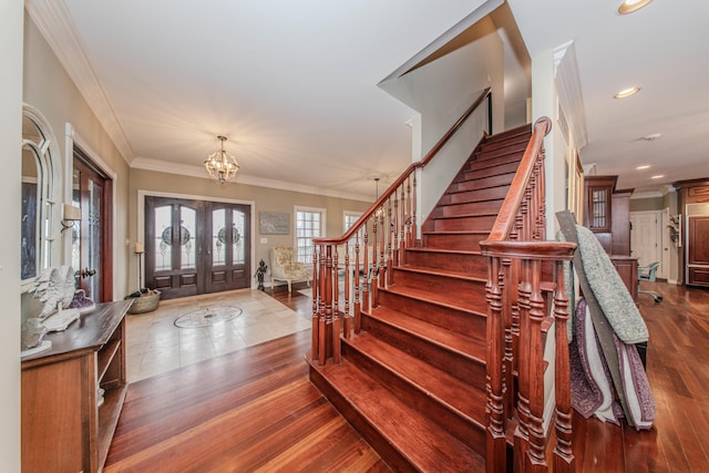 5050 Pleasant Lake Rd, Ann Arbor, MI 48103 - entryway featuring stairway, crown molding, a chandelier, dark wood finished floors, and recessed lighting