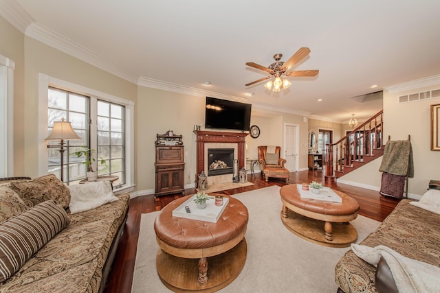 5050 Pleasant Lake Rd, Ann Arbor, MI 48103 - living room featuring stairs, wood finished floors, crown molding, a fireplace, and ceiling fan