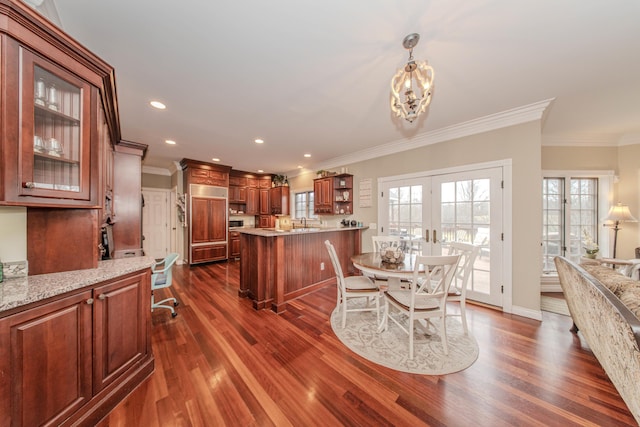 5050 Pleasant Lake Rd, Ann Arbor, MI 48103 - dining room featuring crown molding, dark wood finished floors, healthy amount of natural light, a chandelier, and recessed lighting