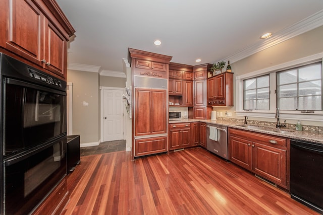 5050 Pleasant Lake Rd, Ann Arbor, MI 48103 - kitchen with black appliances, ornamental molding, dark wood finished floors, light stone counters, and recessed lighting