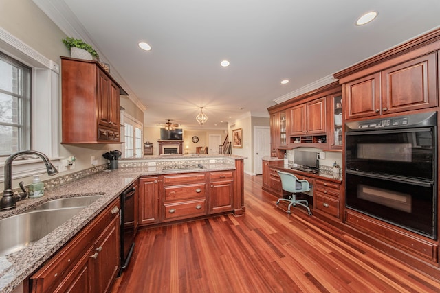5050 Pleasant Lake Rd, Ann Arbor, MI 48103 - kitchen featuring black appliances, dark wood-style floors, a peninsula, crown molding, and light stone counters