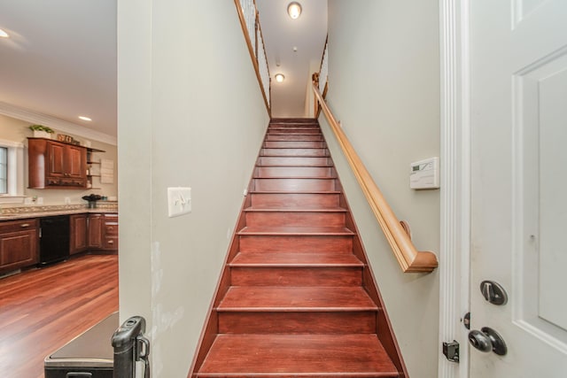 5050 Pleasant Lake Rd, Ann Arbor, MI 48103 - stairs featuring crown molding, wood finished floors, and recessed lighting