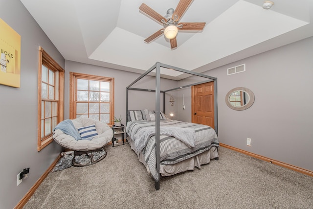 5050 Pleasant Lake Rd, Ann Arbor, MI 48103 - carpeted bedroom with a tray ceiling and ceiling fan
