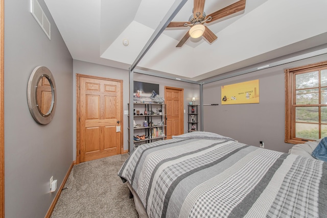 5050 Pleasant Lake Rd, Ann Arbor, MI 48103 - bedroom featuring carpet flooring, a tray ceiling, and a ceiling fan