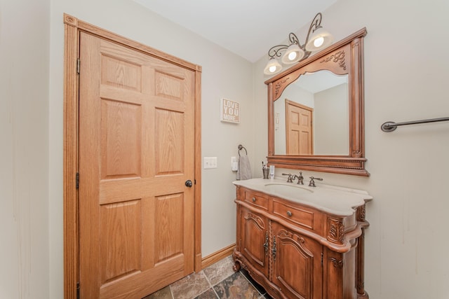 5050 Pleasant Lake Rd, Ann Arbor, MI 48103 - bathroom with vanity and stone finish flooring