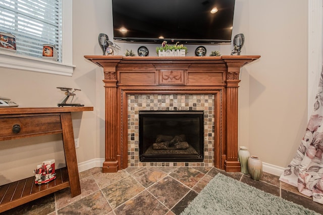 5050 Pleasant Lake Rd, Ann Arbor, MI 48103 - detailed view of a tile fireplace and baseboards
