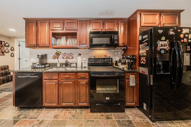 5050 Pleasant Lake Rd, Ann Arbor, MI 48103 - kitchen featuring black appliances, stone tile floors, dark stone countertops, and recessed lighting